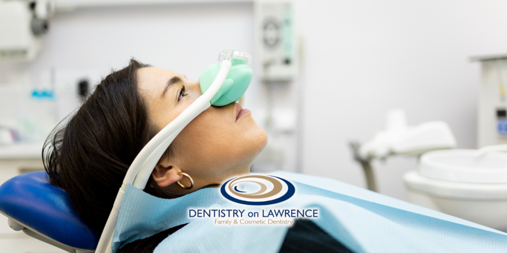Dentist offering sedation at Dentistry on Lawrence providing gentle care to relaxed patient